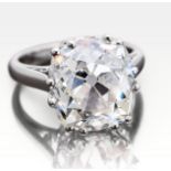 6.89 carat old cushion cut diamond, set in an ornate platinum ring.