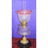 Victorian Oil Lamp With Plain Glass Reservoir And Cranberry Frilled Globe