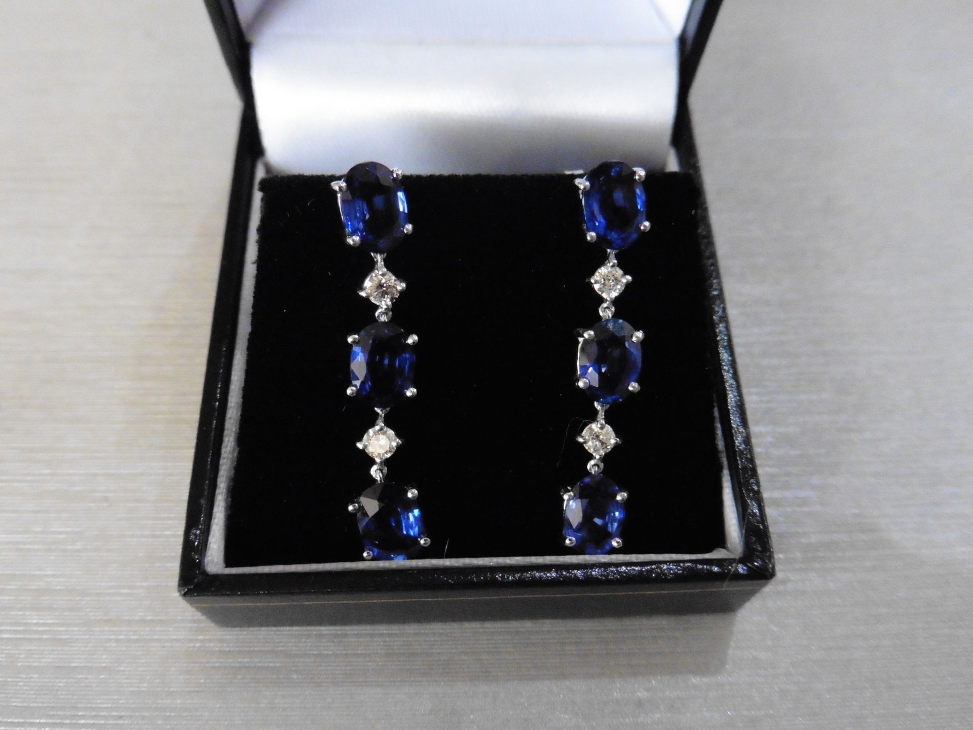 4.80ct sapphire and 0.12ct diamond drop earrings. Each set with 3 oval cut sapphires and 2 brilliant - Image 4 of 4