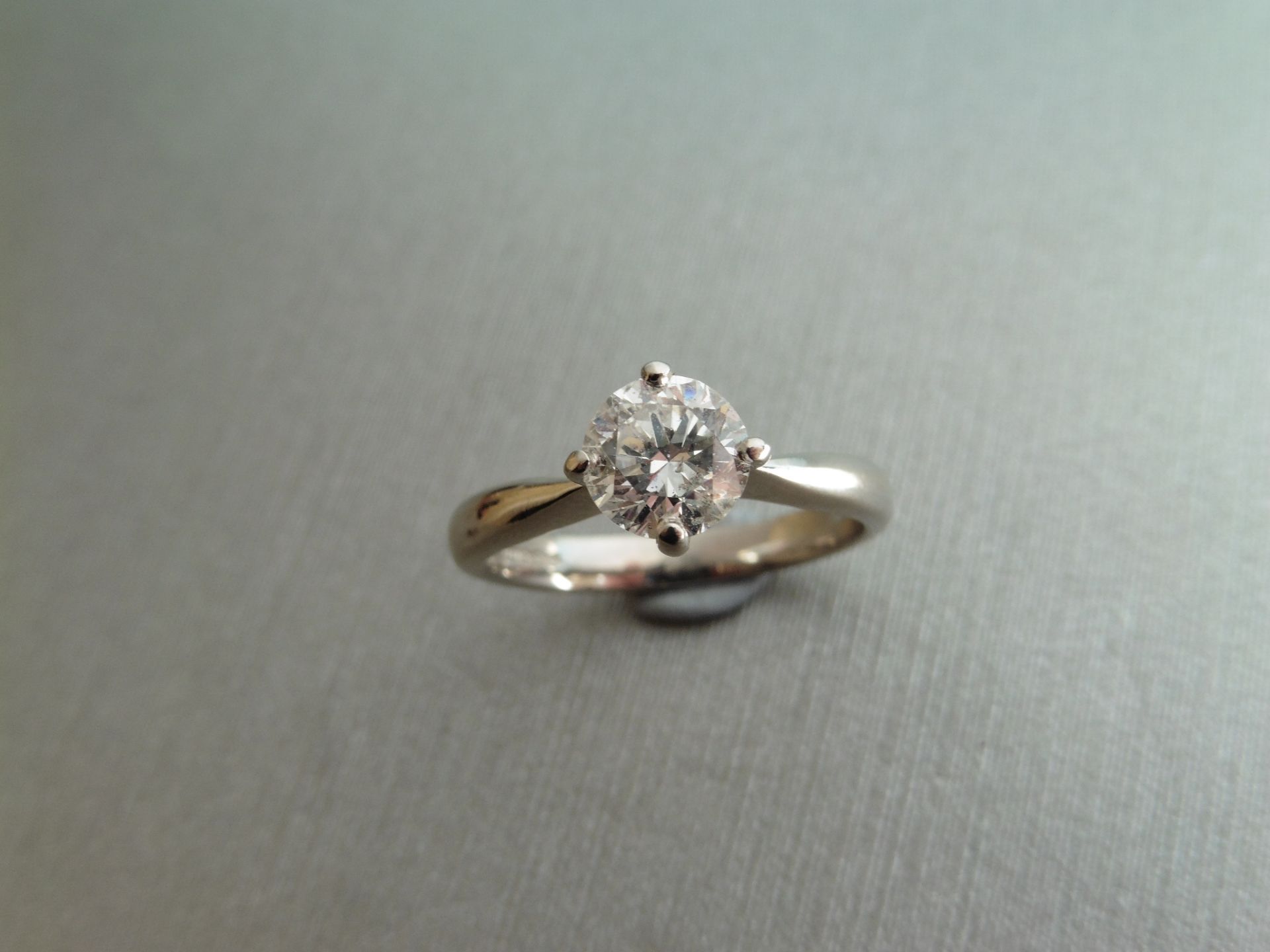 0.91ct Diamond solitaire ring with a brilliant cut diamond, H colour and Si1 clarity. Set in