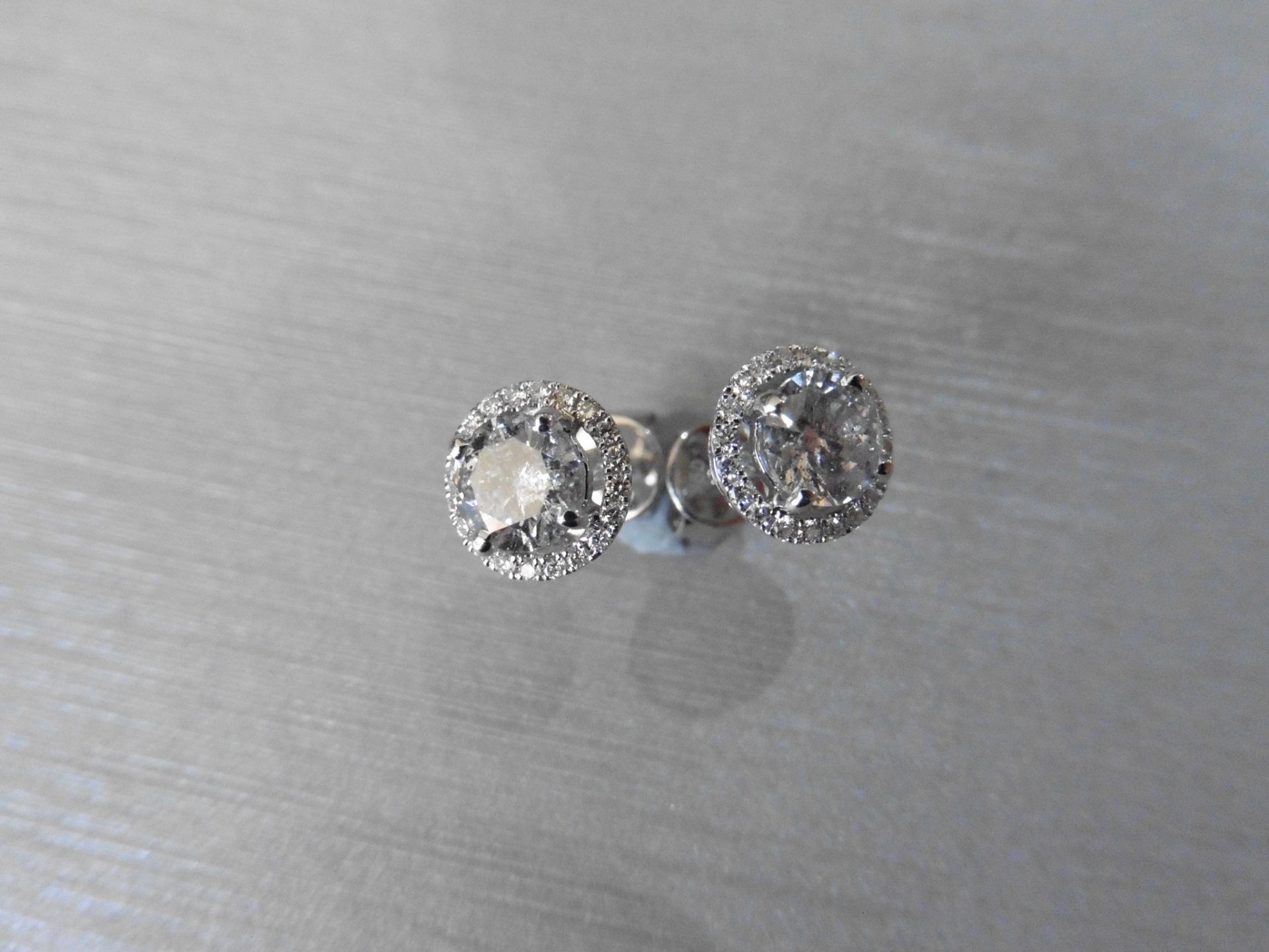 2.00ct Diamond set solitaire style earrings. Each set with 1ct brilliant cut diamond ( enhanced