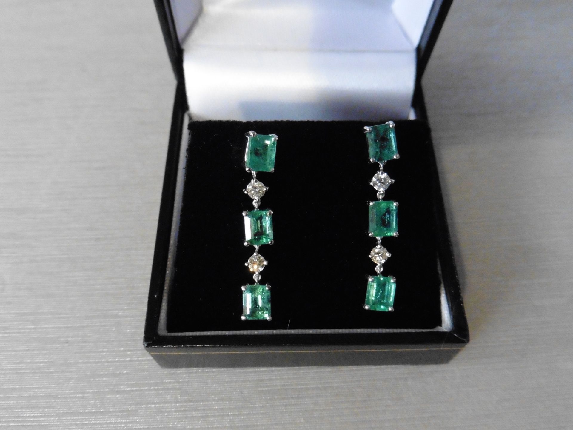 2.50ct Emerald and 0.10ct diamond drop earrings. Each set with 3 emerald cut emeralds and 2 - Image 4 of 4