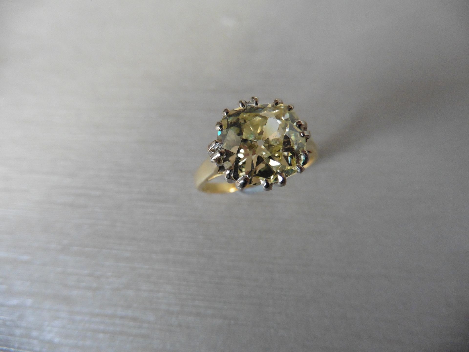 3.43ct solitaire ring. Set with an old cut diamond, fancy yellow colour, VS clarity. 16 (Double)