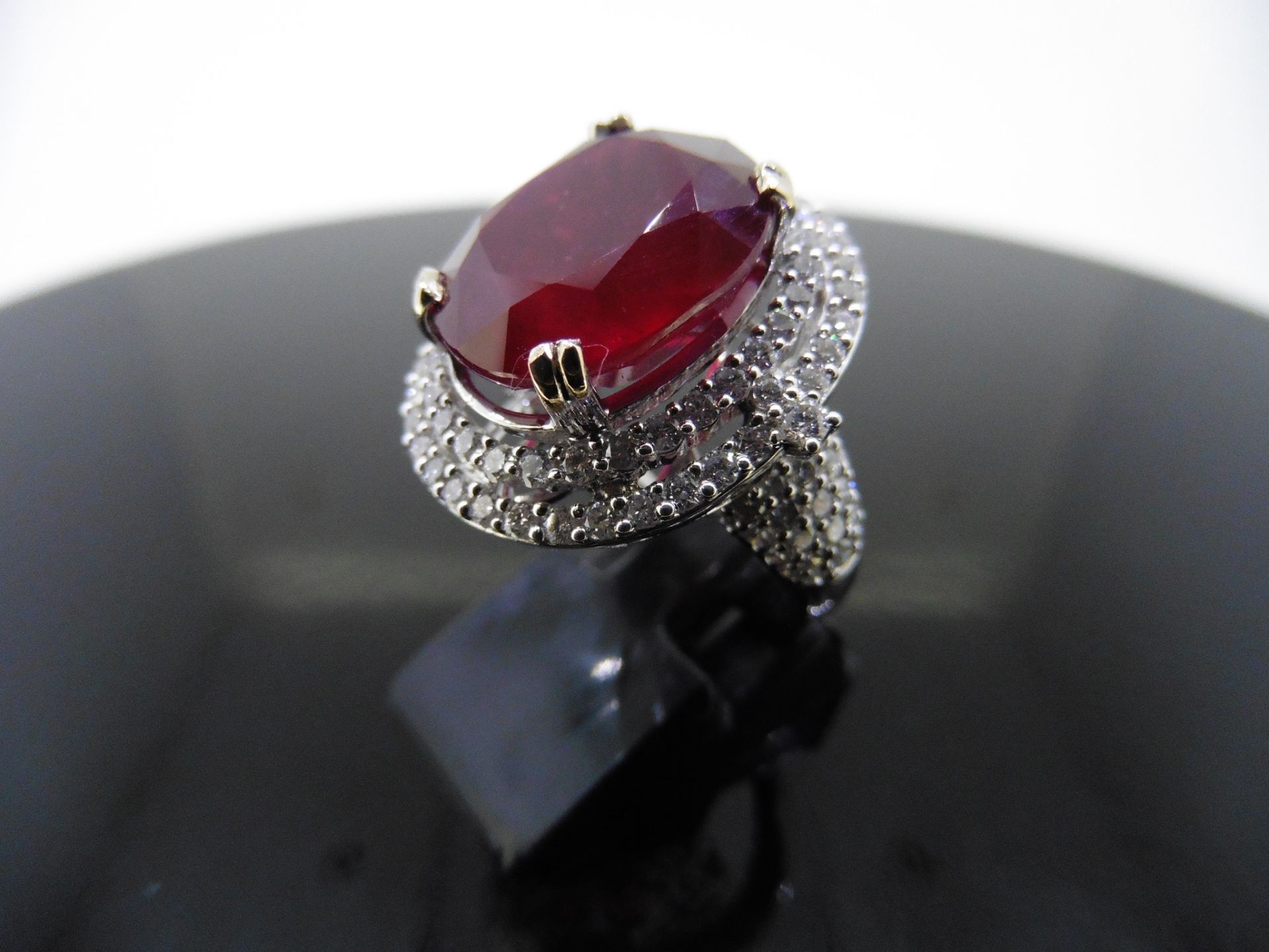 12.30ct Ruby and diamond fancy dress ring. Oval cut ruby ( treated ) set in a four claw setting - Image 2 of 5