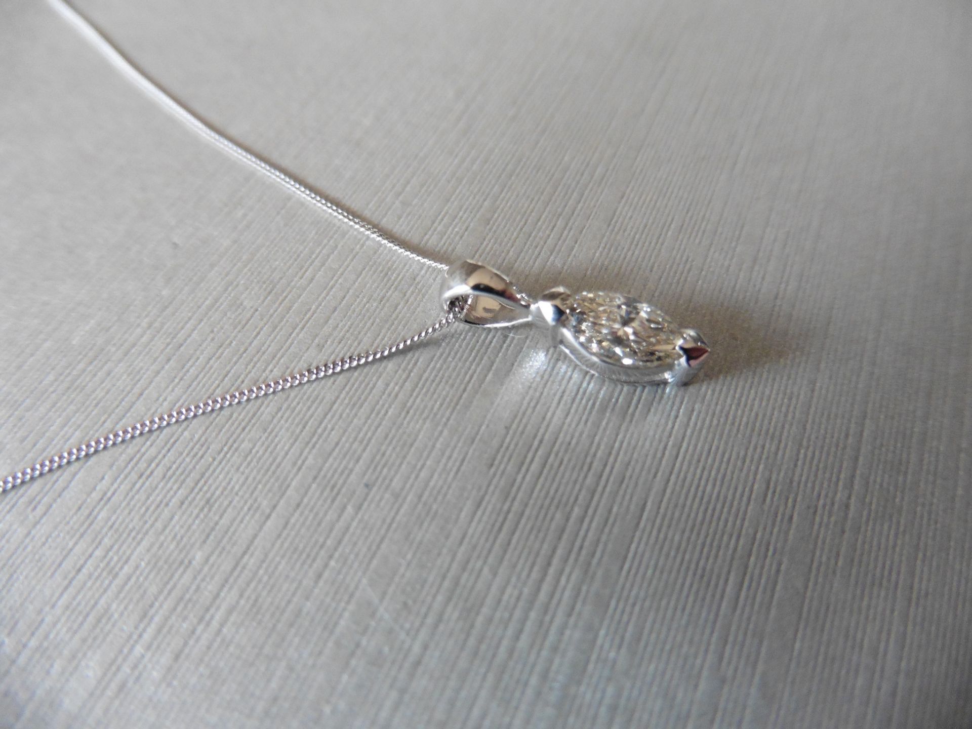 0.70ct diamond solitaire pendant set with a marquise shaped diamond, I colour, VS2 clarity. 2 claw - Image 2 of 4