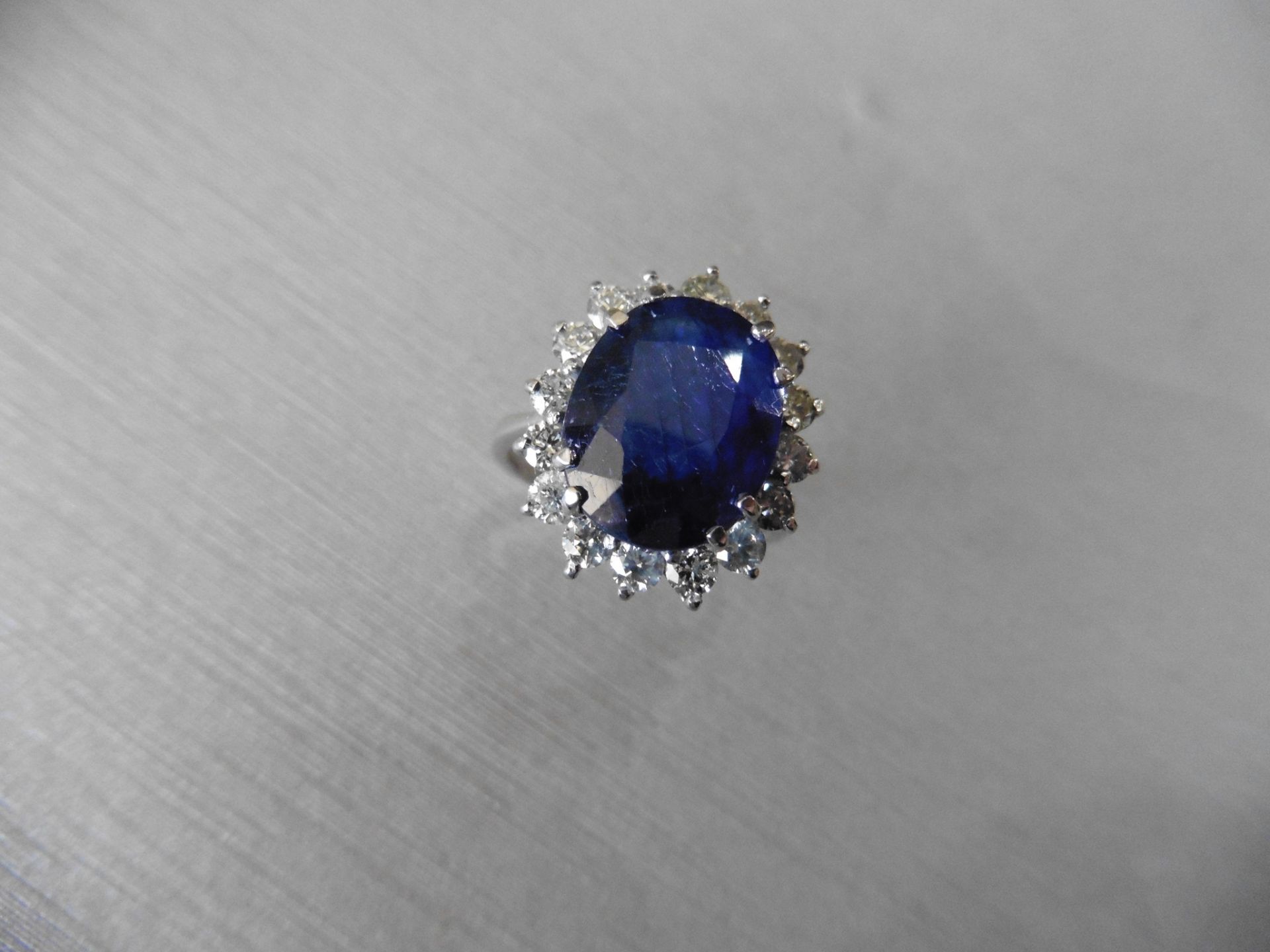 6ct sapphire and diamond cluster ring. Oval cut colour treated sapphire surrounded by brilliant - Image 4 of 4