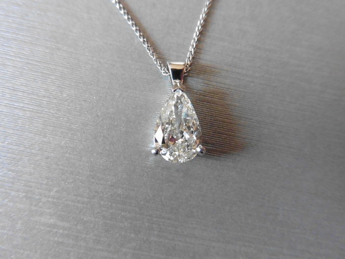0.70ct diamond solitaire pendant set with a pear shaped diamond, I colour, Si1 clarity. 3 claw