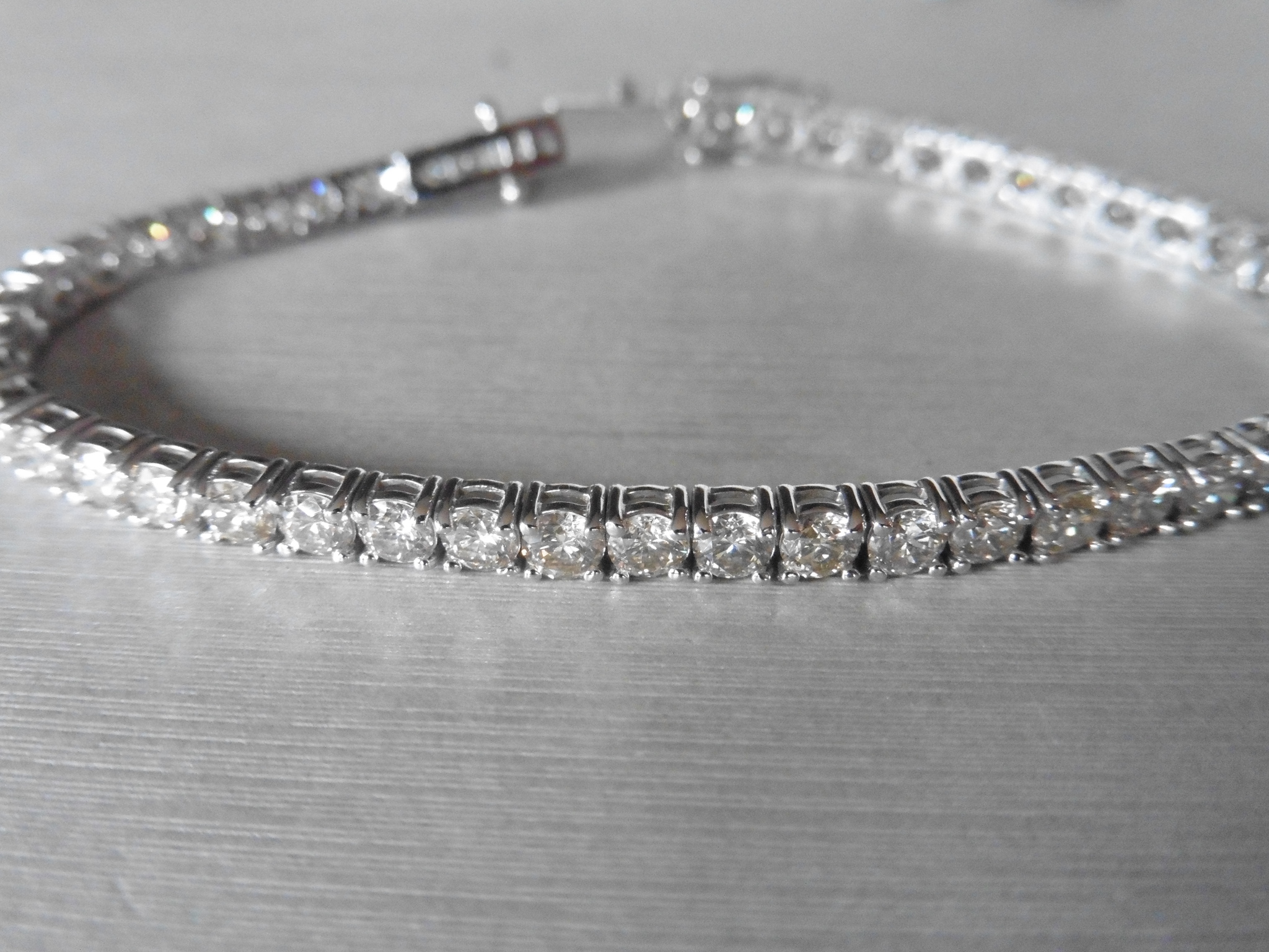 6.60ct Diamond tennis bracelet set with brilliant cut diamonds of I/J colour, si2 clarity. All set