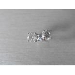 2.00ct Solitaire diamond stud earrings set with brilliant cut diamonds which have been enhanced. H/I