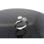 2ct diamond twist ring set with 2 brilliant cut diamonds, J colour, P1 clarity. Set in a claw