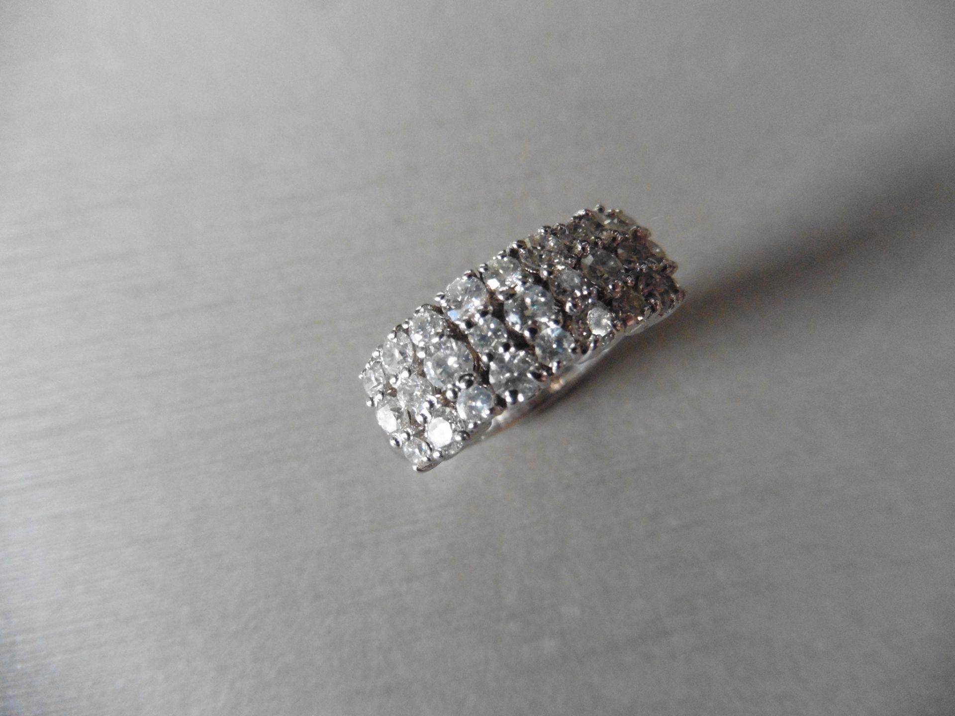 1.33ct Diamond band ring. Set with 3 rows of brilliant cut diamonds, I colour, si1-2 clarity. Claw