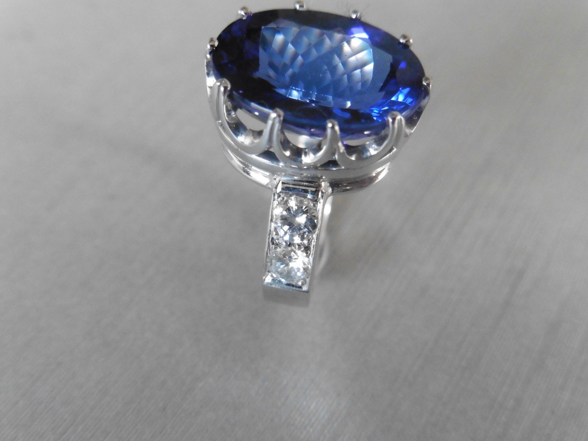 8.85ct tanzanite and diamond dress ring. Oval cut AAAA tanzanite secured in a 10 claw basket setting - Image 2 of 5