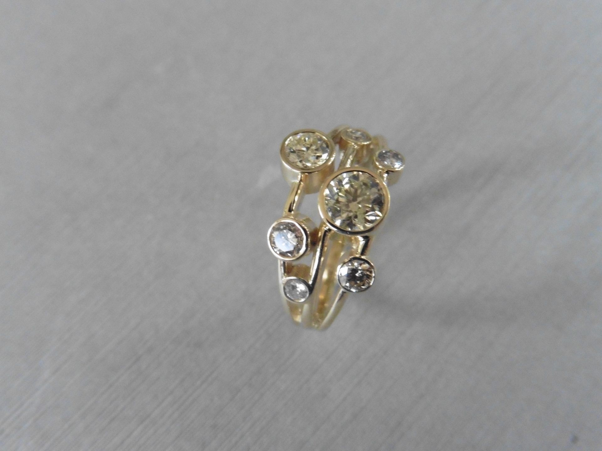 1.00ct 9ct yellow gold diamond dress ring, rain dance style. Set with 7 graduated brilliant cut - Image 4 of 4