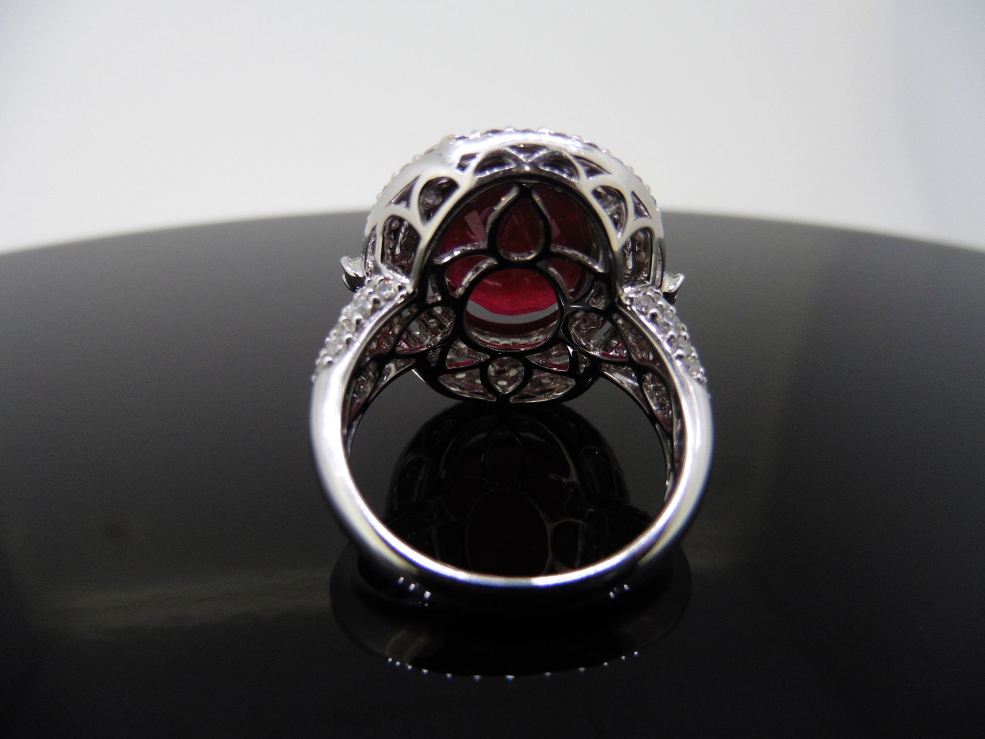 12.30ct Ruby and diamond fancy dress ring. Oval cut ruby ( treated ) set in a four claw setting - Image 3 of 5