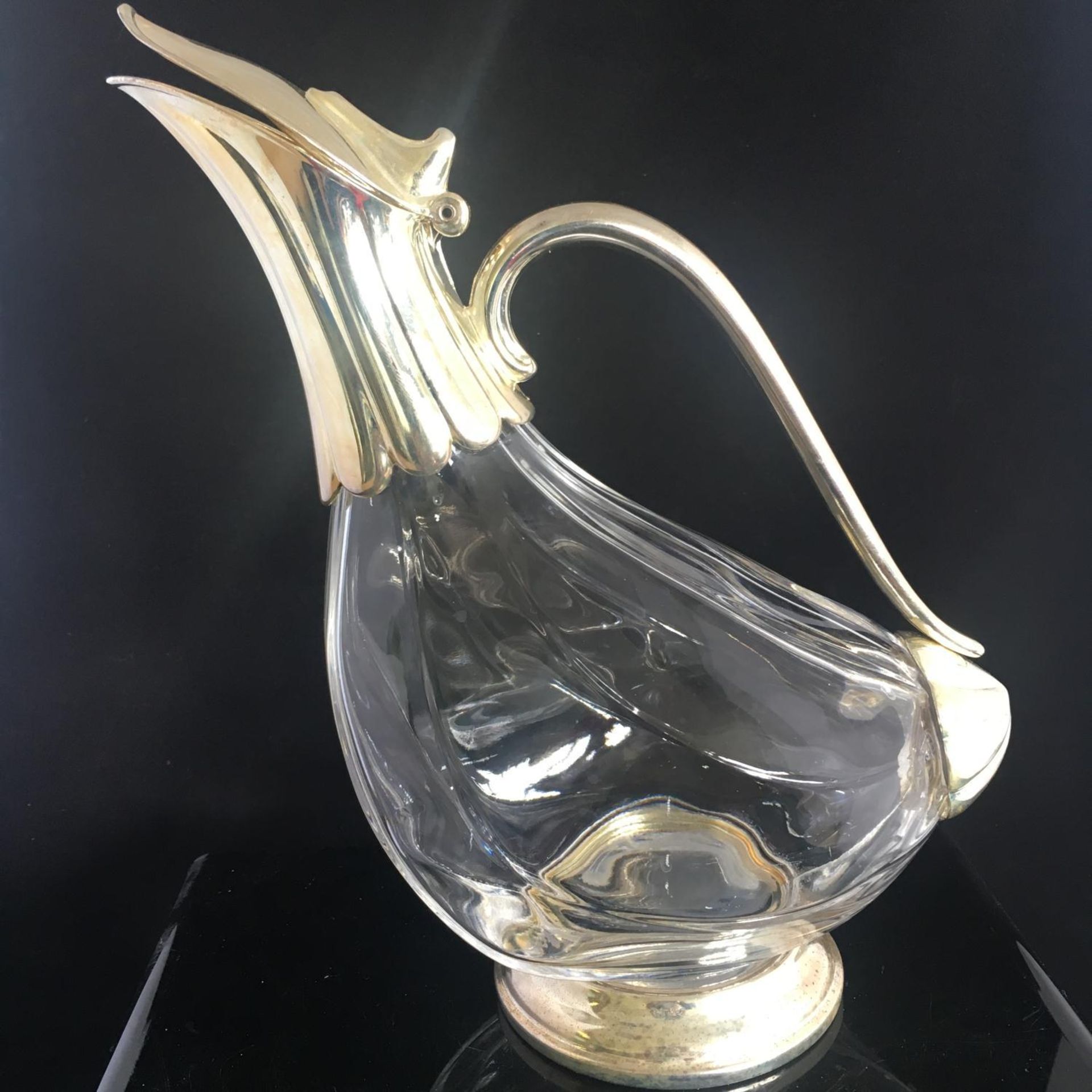 SILVER PLATED AND GLASS DUCK SHAPED WINE DECANTER. In good overall condition with no chips or