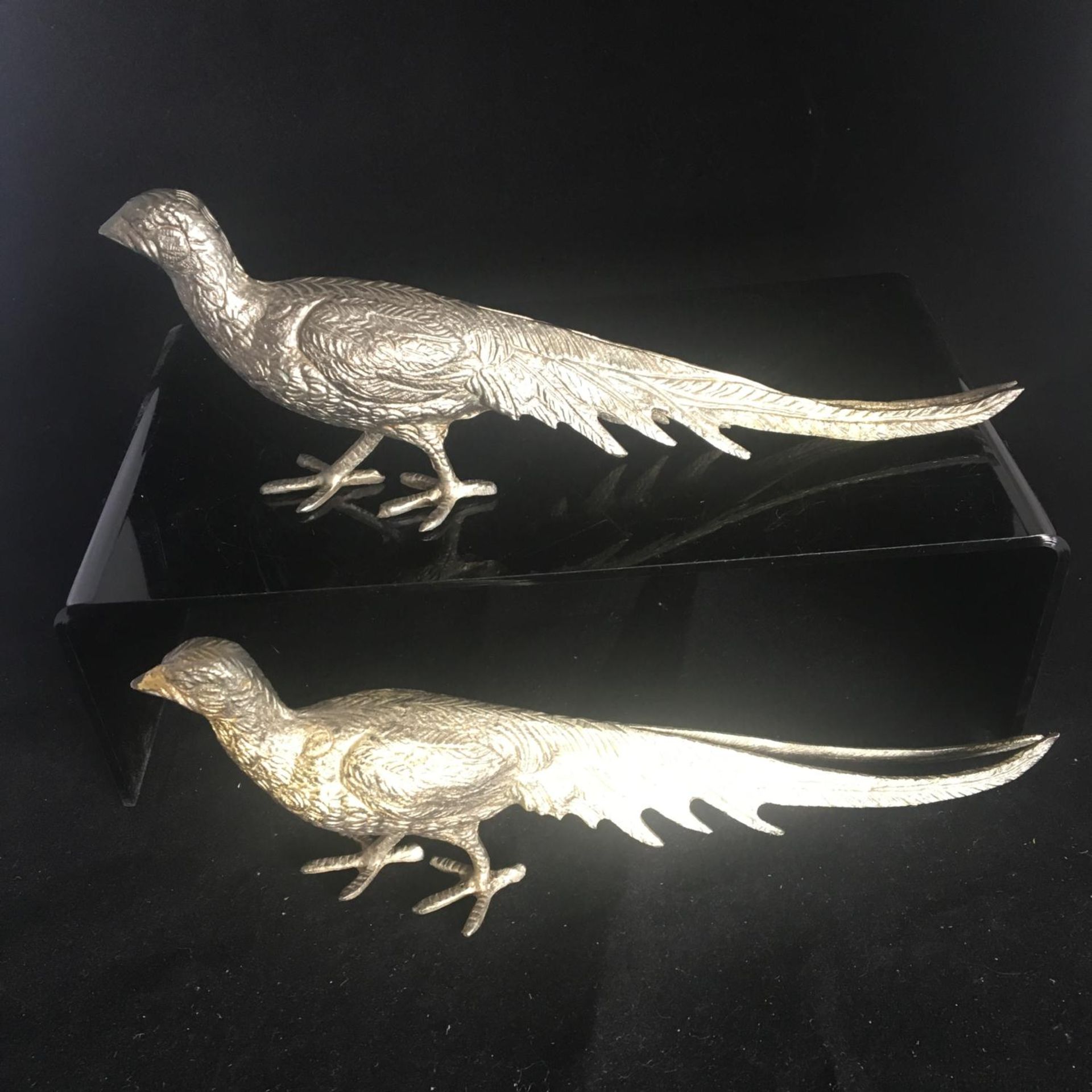Pair of white metal table pheasants, each at 24cm long. Includes free UK delivery.