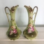 Pair porcelain jug vases, impressed numbers to base. Handpainted details over transferware roses