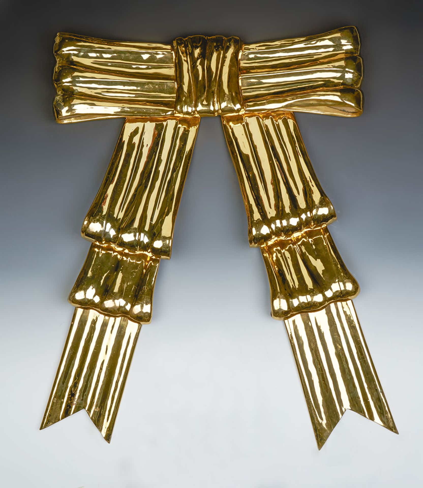 DULANY STUDIO GILT METAL BOW BY HELEN HUGHES EARLY 20TH C.