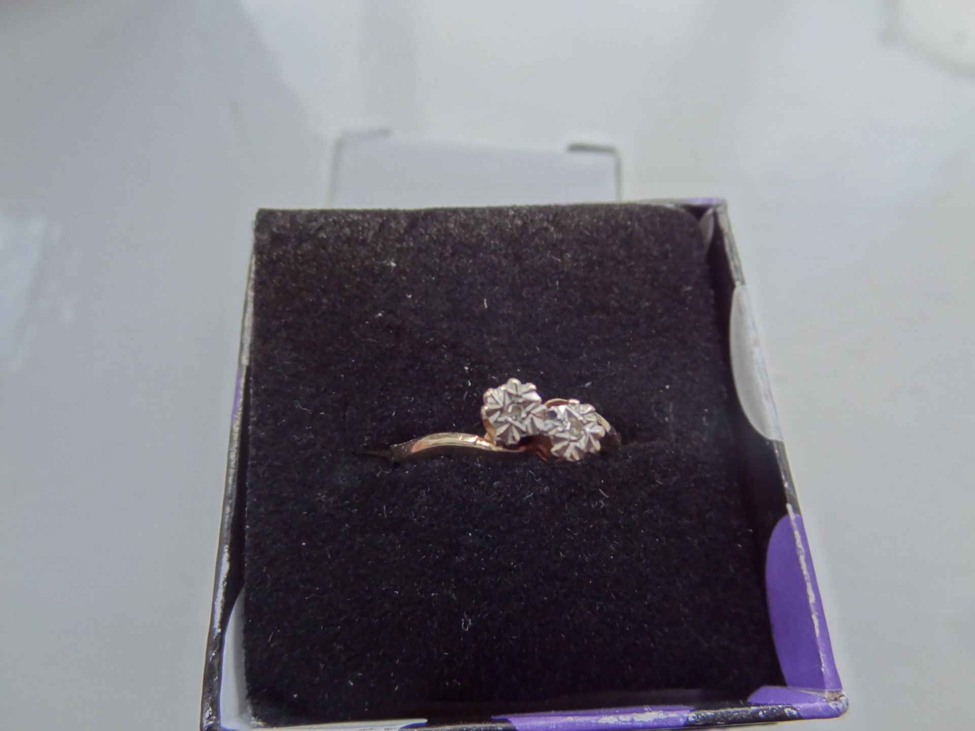 9CT Gold Ring Comprising Two Round Cut Diamond sin a White Gold Illusion Setting