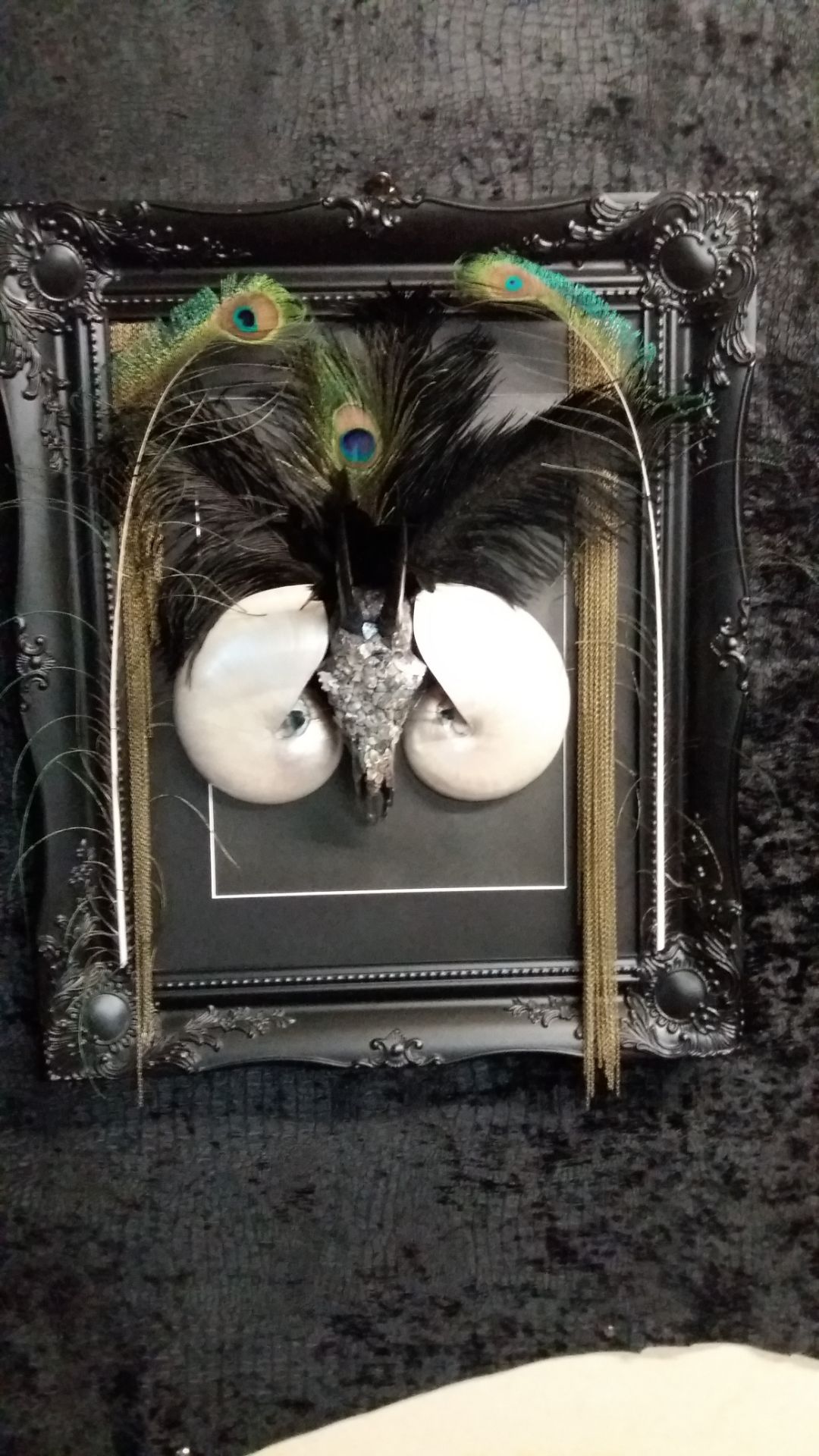 mother of earth 3d skull Art sculpture feathers skulls chain and shell