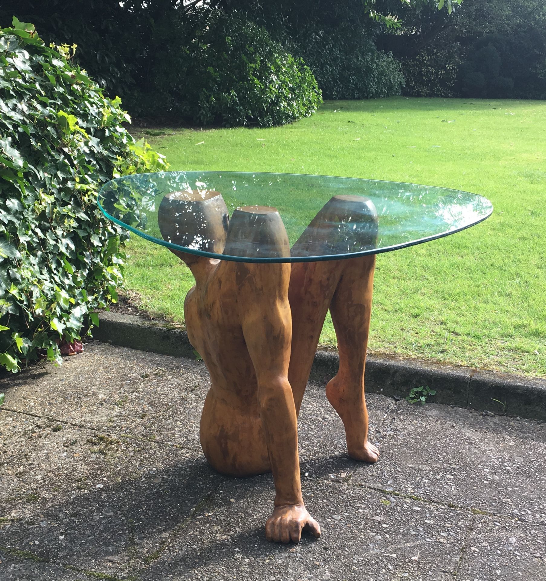 Carved Wood figurative sculptural table, 76 x 54 cms, with rounded triangular glass top - Image 5 of 12