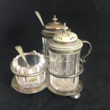 VINTAGE SILVER PLATE CRUET SET. Comprising handled stand with salt, pepper and mustard pot. Includes