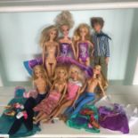 Collection of Barbie and Ken dolls together with some accessories. Includes free UK delivery.