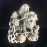 Chinese carved soapstone figure, Dogs of Fo on a naturalistic base. Measures 12cm tall. Includes