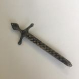 An antique sterling silver kilt pin or brooch in the form of a Celtic sword. Stamped Sterling