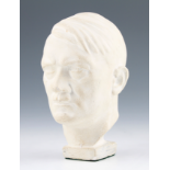 A GERMAN WHITE PLASTER BUST OF ADOLF HITLER, BEARS INDISTINCT NAME TO REAR, HEIGHT 21CM