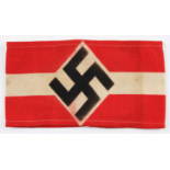 A GERMAN HITLER YOUTH ARM BAND SHOWING SWASTIKA WITH BLACK STAMP MARKS TO REAR.