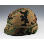 A US M1 DARK GREEN HELMET WITH JUNGLE CAMP COVER WITH LINER