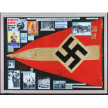 A framed and glazed Hitler Youth display containing Nazi swastika flag