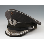 A GERMAN BUNDESWEHR PEAKED CAP IN GREY. - This lot is offered with free UK delivery. Please note