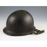 A US M1 PATTERN HELMET WITH BLACK ON GREEN FINISH WITH LINER