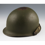 A US M1 pattern helmet with medium green finish with liner