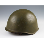 A Cold war Russian green helmet with liner, dated to interior 1948