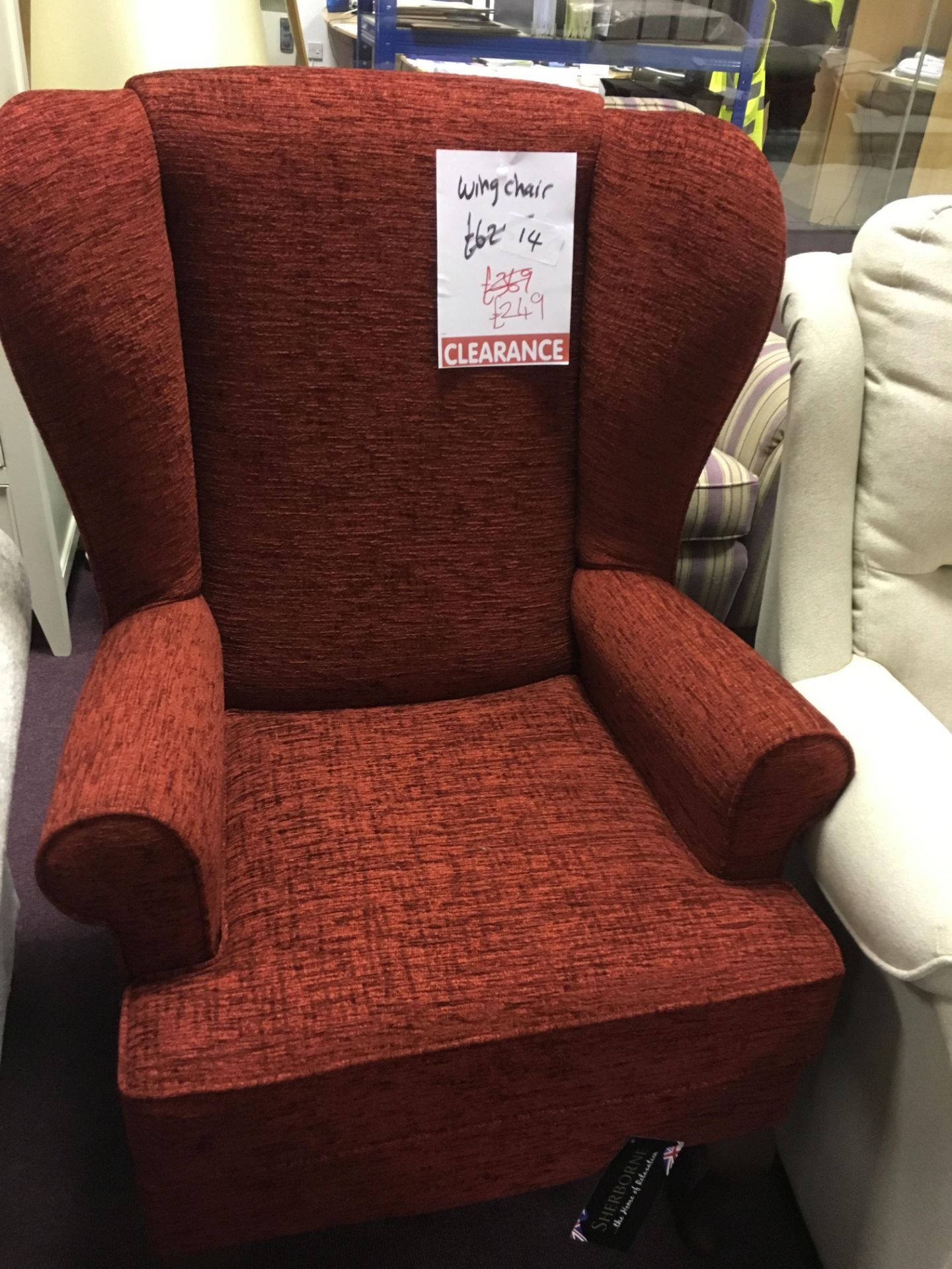 Red high wingback chair, ex-display in a showroom, excellent condition like new