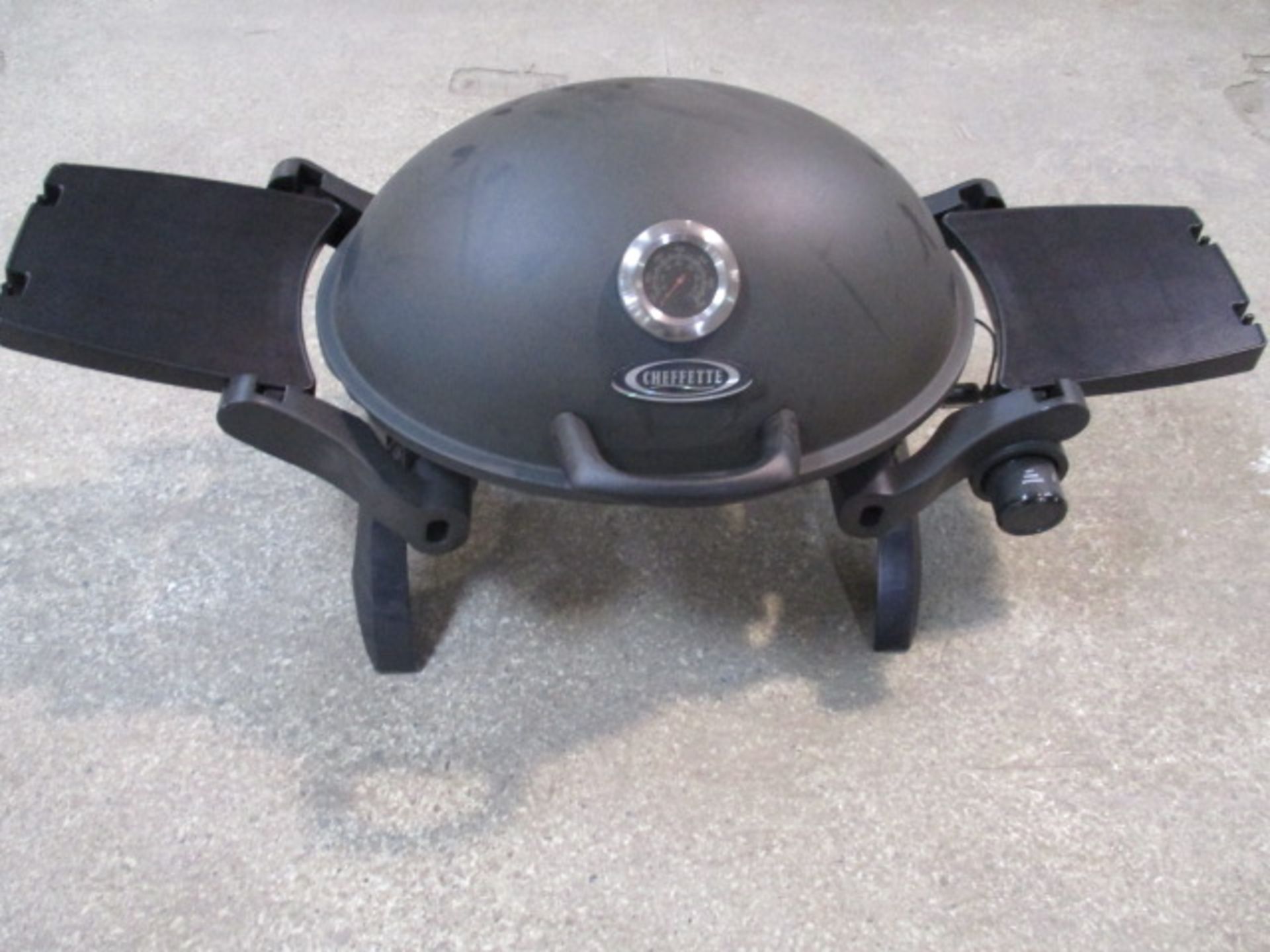 Unused Cheffette portable gas barbecue with side trays and standing legs