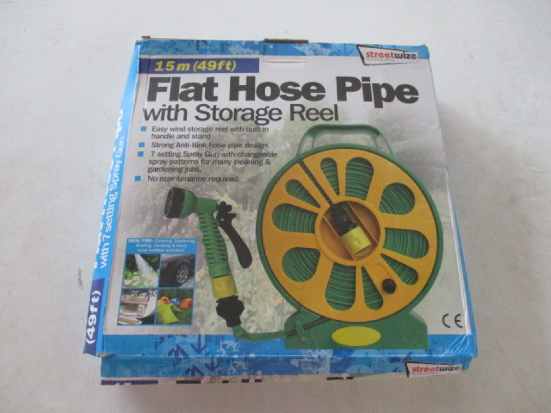 Unused Flat hose - 50ft on storage wheel with multi nozzle rrp £19.99 .