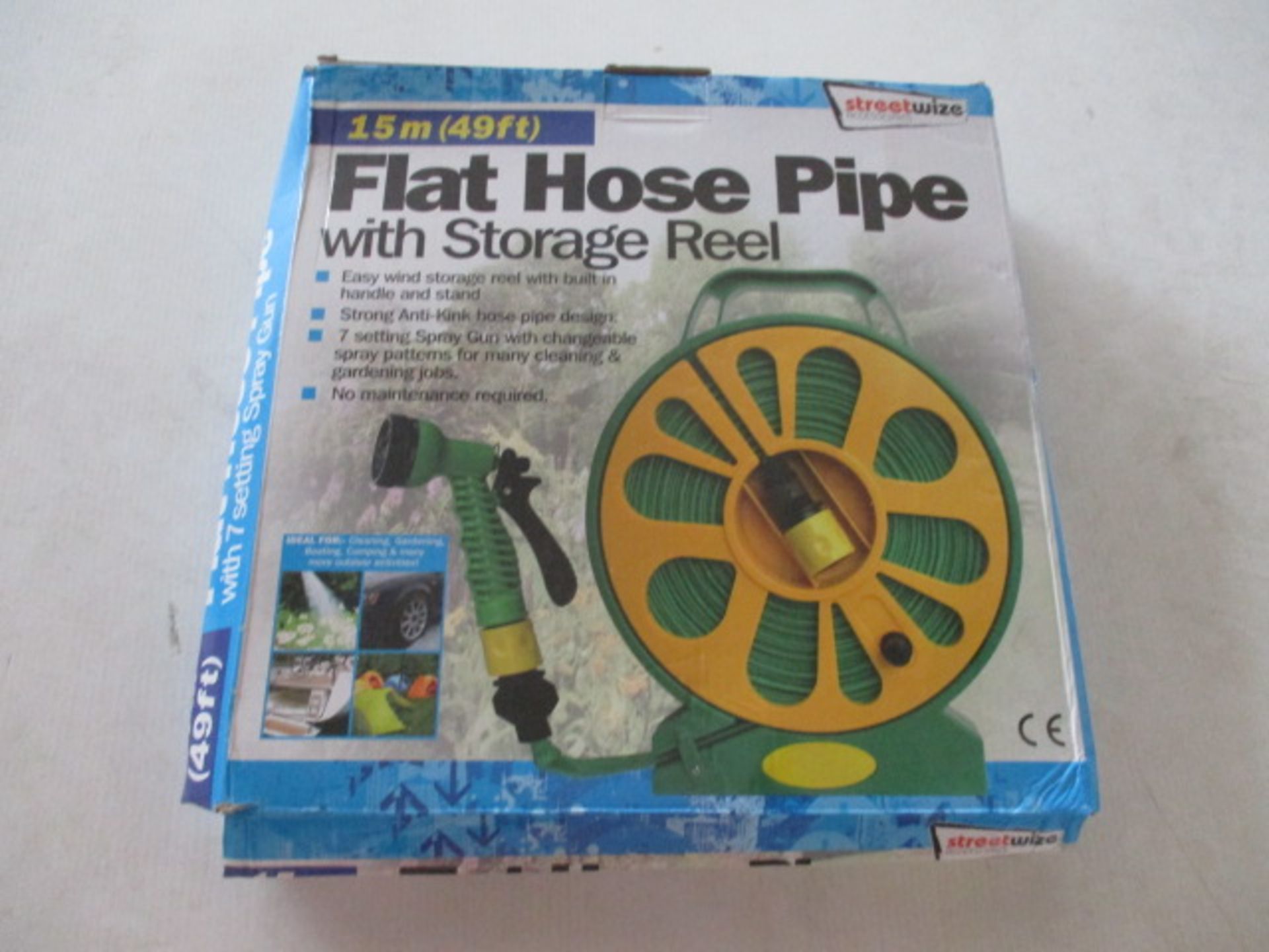 Unused Flat hose - 50ft on storage wheel with multi nozzle rrp £19.99 .
