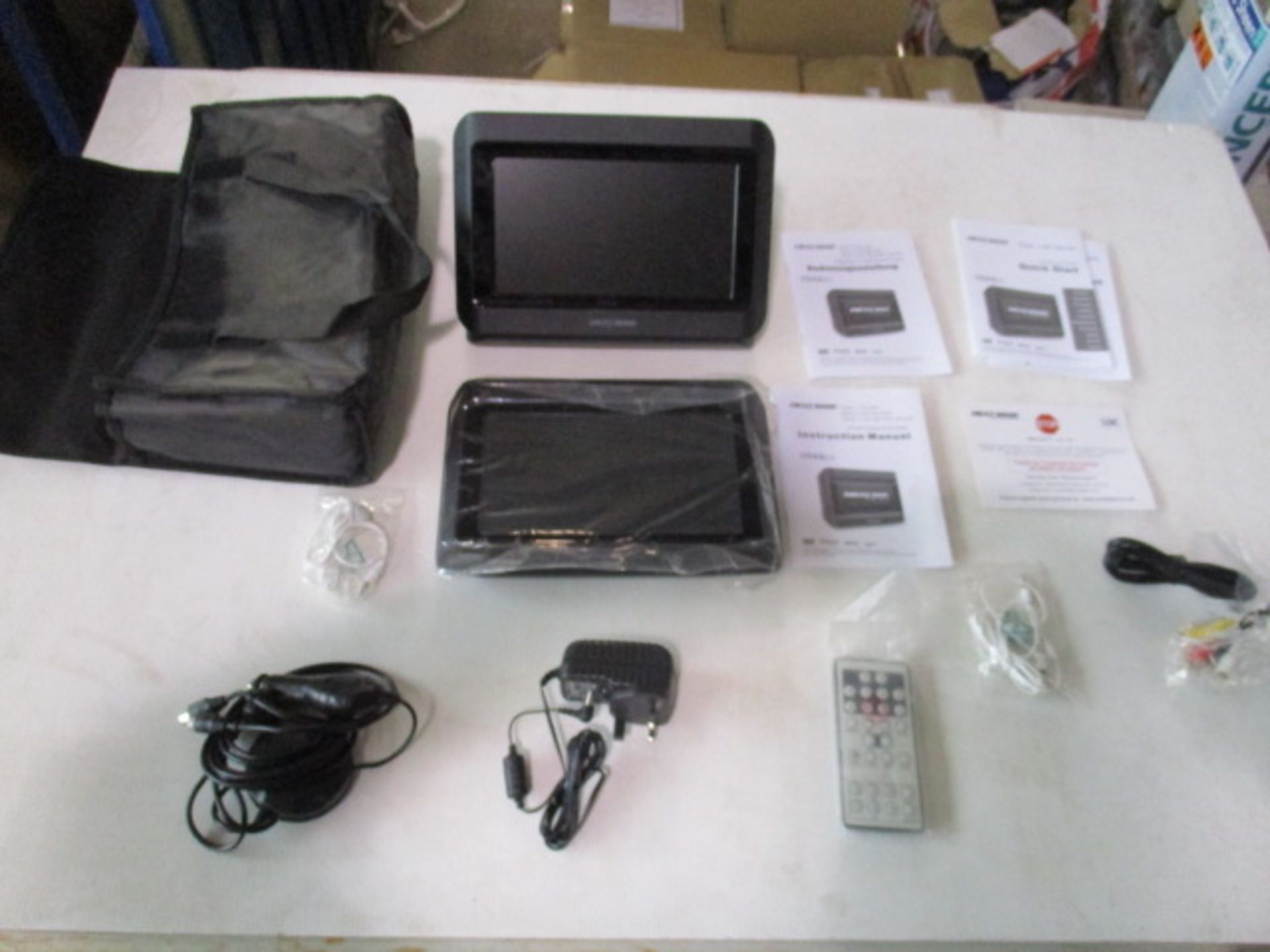 Unused Next Base 2 x monitors plus portable DVD player with all attachements and remote as