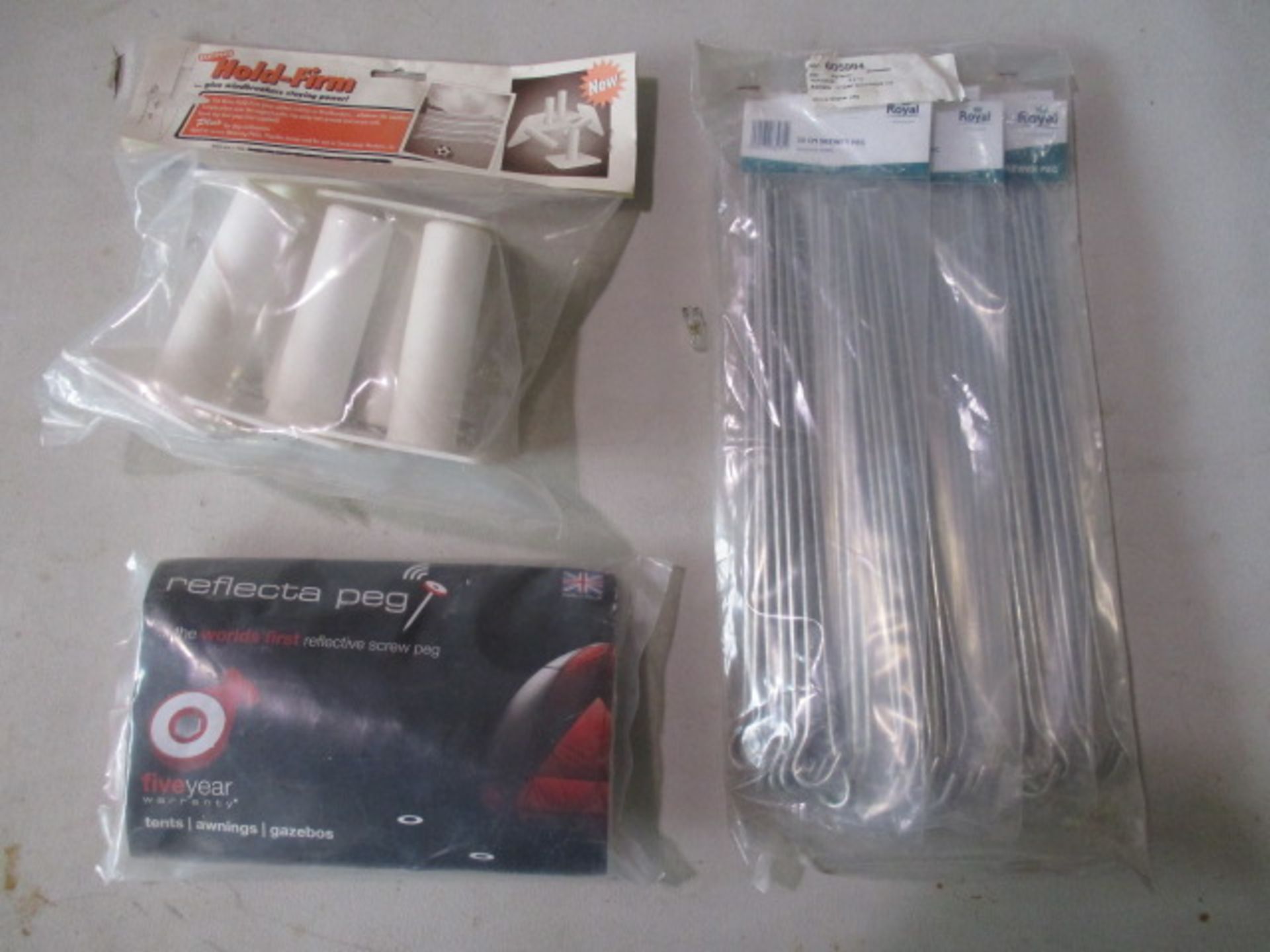 Sealed 50 skewer pegs, 1 pack hold firm windbreaker feet and 1 pack reflectors pegs all Sealed for