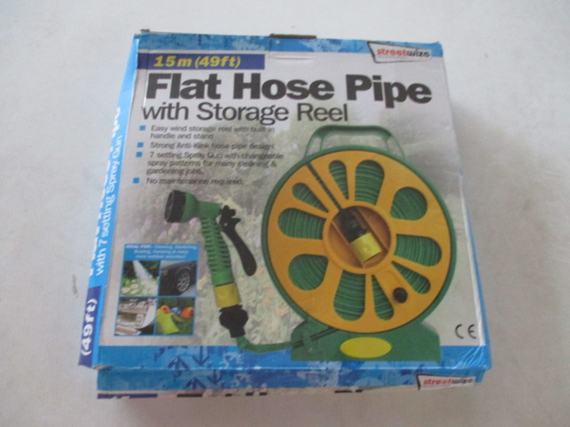 Unused Flat hose - 50ft on storage wheel with multi nozzle rrp £19.99 .