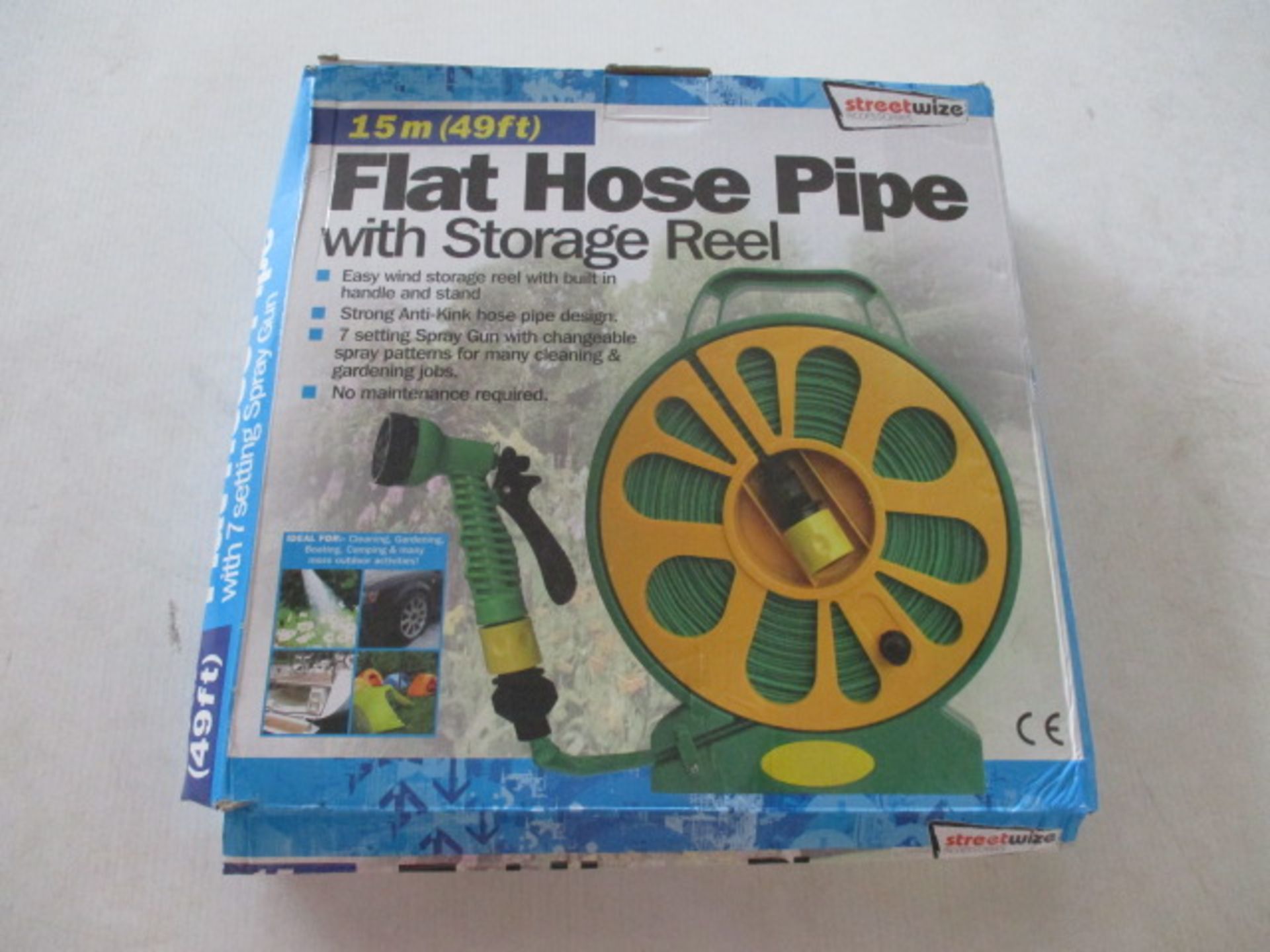 Unused Flat hose - 50ft on storage wheel with multi nozzle rrp £19.99 .