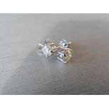 1.40ct Diamond solitaire earrings set with brilliant cut diamonds, I colour I1 clarity. Four claw