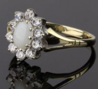 9CT GOLD CLUSTER RING, COMPRISING AN OVAL OPAL CABOCHON