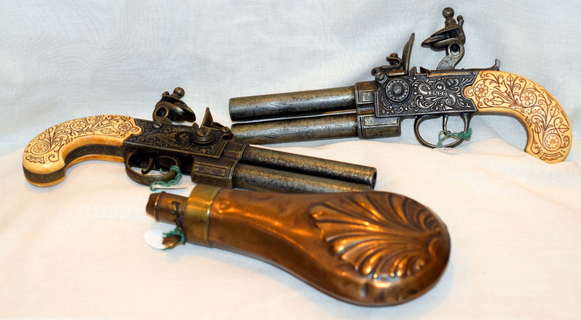 Pair Of Over And Under Duelling Pistols Replicas And 19th Century Powder Flask