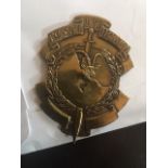 unknown brass military badge,