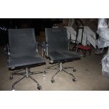 2 x Black office chairs